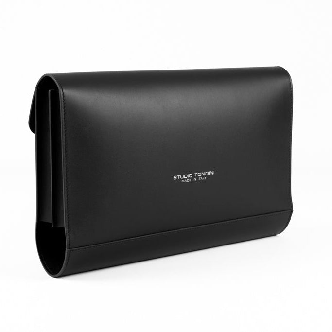 The Document Holder by Studio Tondini. Three-quarter view of black leather bag, highlighting impeccable craftsmanship and dual-compartment structure.